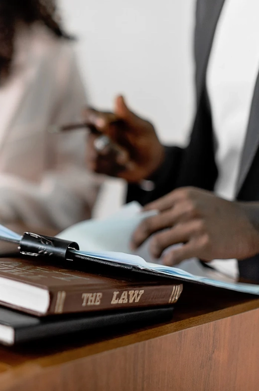 Attorney reviewing family law documents beside a law book